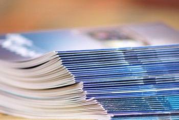 A stack of digitally printed catalogs, collated and folded