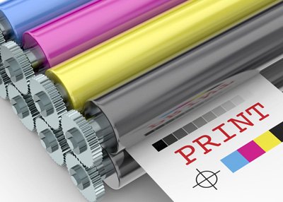 Illustration of a four-color press: cyan, magenta, yellow and black rollers over a printed sheet